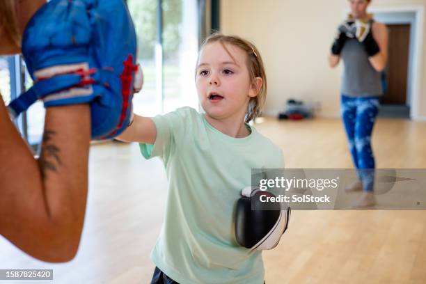 taking on an opponent - martial arts instructor stock pictures, royalty-free photos & images