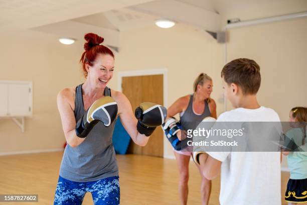 having fun while staying active - child punching stock pictures, royalty-free photos & images