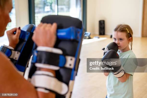 striving for her best - martial arts instructor stock pictures, royalty-free photos & images