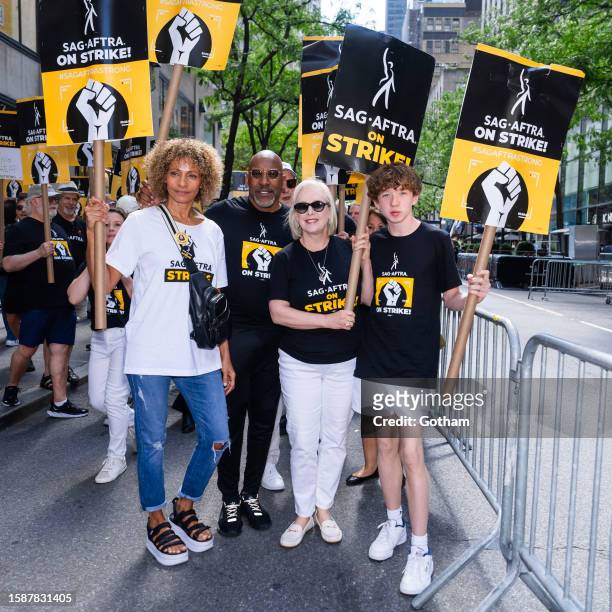 Michelle Hurd, Ezra Knight, Senator Kirsten Gillibrand and Theodore Gillibrand are seen at the SAG-AFTRA strike in Midtown on August 02, 2023 in New...