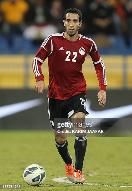 Egypt's Mohammed Abu Trika controls the ball during a friendly football match in the Qatari capital Doha on December 28, 2012. Egypt won 2-0. AFP...