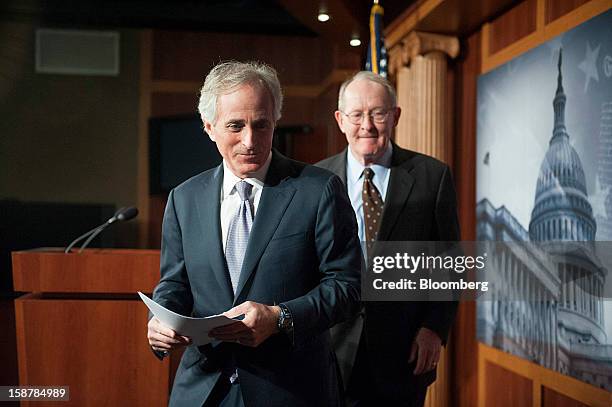 Republican Senators Lamar Alexander, right, and Bob Corker, both from Tennessee, depart following a news conference in Washington, D.C., U.S., on...