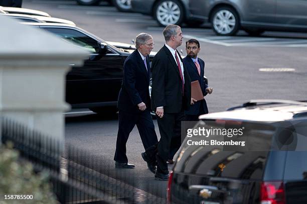 Senate Minority Leader Mitch McConnell, a Republican from Kentucky, left, leaves after a meeting with U.S. President Barack Obama at the White House...
