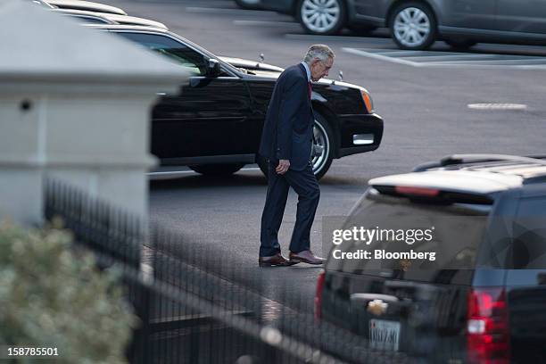 Senate Majority Leader Harry Reid, a Democrat from Nevada, leaves after a meeting with U.S. President Barack Obama at the White House in Washington,...