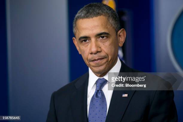 President Barack Obama pauses while speaking in the Brady Press Briefing Room at the White House in Washington, D.C., U.S., on Friday, Dec. 28, 2012....