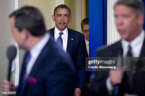 President Barack Obama arrives to speak in the Brady Press Briefing Room at the White House in Washington, D.C., U.S., on Friday, Dec. 28, 2012....