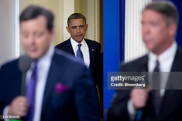 President Barack Obama arrives to speak in the Brady Press Briefing Room at the White House in Washington, D.C., U.S., on Friday, Dec. 28, 2012....