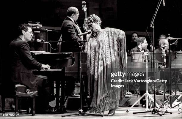 Cuban-American salsa performer Celia Cruz and her band onstage during a Jazz at Lincoln Center concert at Alice Tully Hall, New York, New York,...