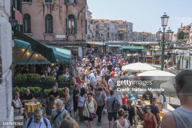 Tourists crowd the area near the Rialto Bridge on August 02, 2023 in Venice, Italy. UNESCO officials have included Venice and its lagoon to the list...