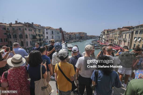 Tourists flock to the Rialto Bridge on August 02, 2023 in Venice, Italy. UNESCO officials have included Venice and its lagoon to the list of world...