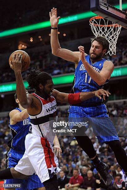 Orlando Magic power forward Josh McRoberts commits a technical foul with a hard foul against Washington Wizards center Nene , left, in the fourth...