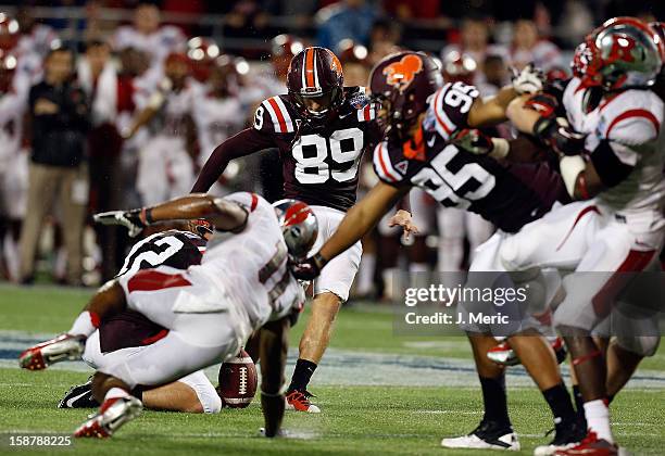 Kicker Cody Journell of the Virginia Tech Hokies kicks what would be the game winning field goal in overtime against the Rutgers Scarlet Knights...