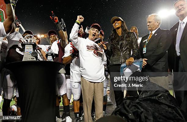 Head coach Frank Beamer of the Virginia Tech Hokies salutes the fans after the victory over the Rutgers Scarlet Knights during the Russell Athletic...