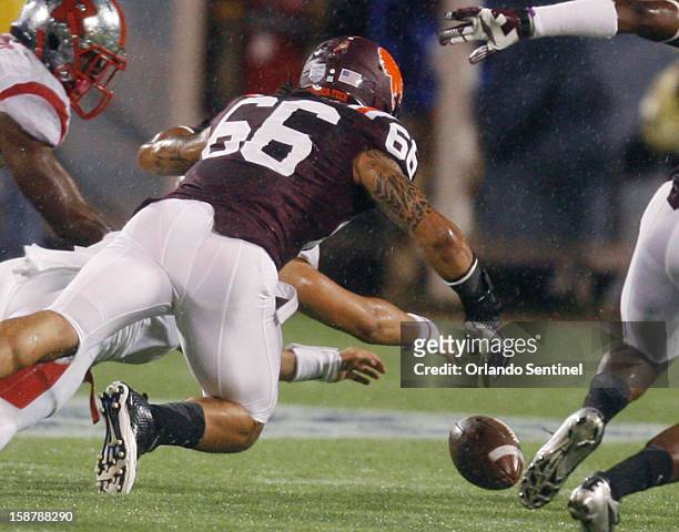 Virginia Tech defensive end Tyrel Wilson goes after a Rutgers fumble in the Russell Athletic Bowl at the Florida Citrus Bowl in Orlando, Florida, on...