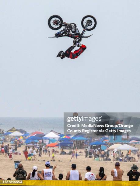 Huntington Beach, CA A rider flies through the air during the Nitro Circus Full Throttle FMX show on opening day of the U.S. Open of Surfing in...