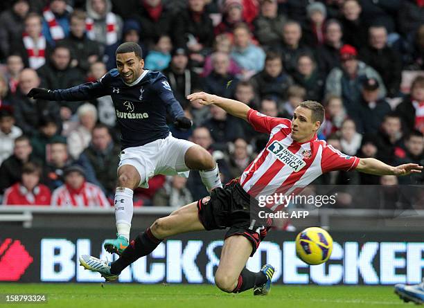 Sunderland's English defender Matthew Kilgallon vies with Tottenham Hotspur's English midfielder Aaron Lennon during the English Premier League...