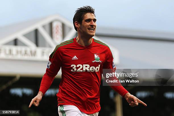 Danny Graham of Swansea City celebrates scoring during the Barclays Premier League match between Fulham and Swansea City at Craven Cottage on...