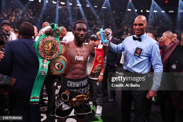 Terence Crawford has his arm raised by Referee Harvey Dock after his 9th round TKO of Errol Spence Jr. At their fight for the undisputed world...