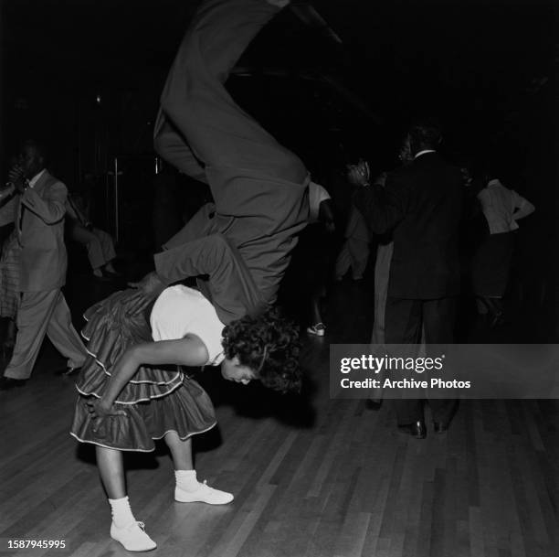 Lindy Hoppers performing a backflip on the dancefloor of the Savoy Ballroom, in the Harlem neighbourhood of the borough of Manhattan, in New York...