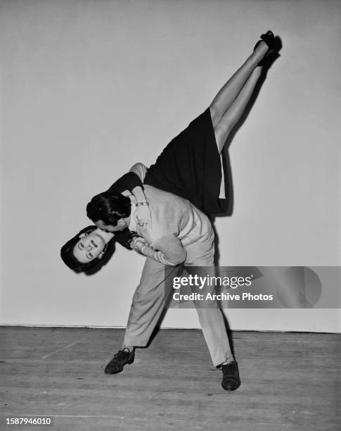 American actress Susan Peters is given a lesson in jitterbugging by dancer Dean Collins in preparation for her role in 'Young Ideas', at MGM Studios...