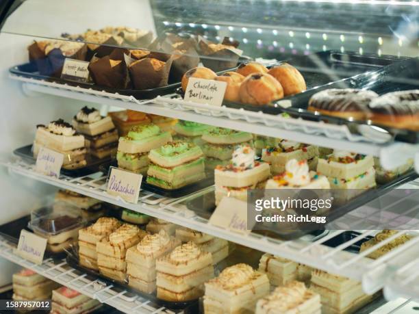 bakery pastry display case - bakery window stock pictures, royalty-free photos & images