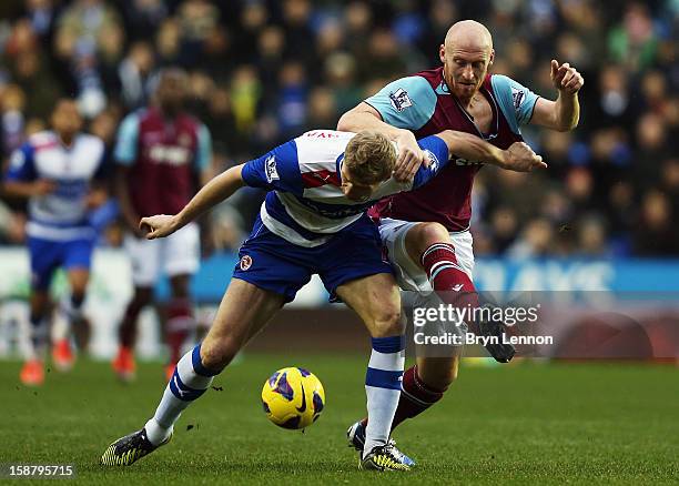 Pavel Pogrebnyak of Reading battles with James Collins of West Ham United during the Barclays Premier League match between Reading and West Ham...