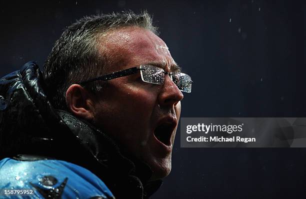 Aston Villa manager Paul Lambert shouts instructions in the rain during the Barclays Premier League match between Aston Villa and Wigan Athletic at...