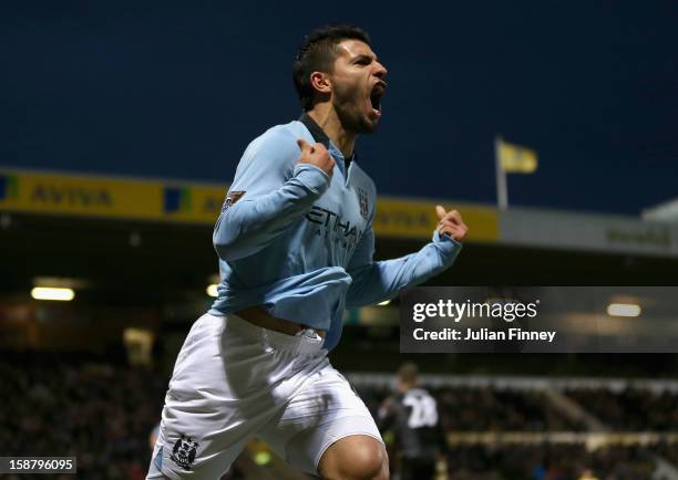 Sergio Aguero of Manchester City celebrates scoring his side's third goal during the Barclays Premier League match between Norwich City and...