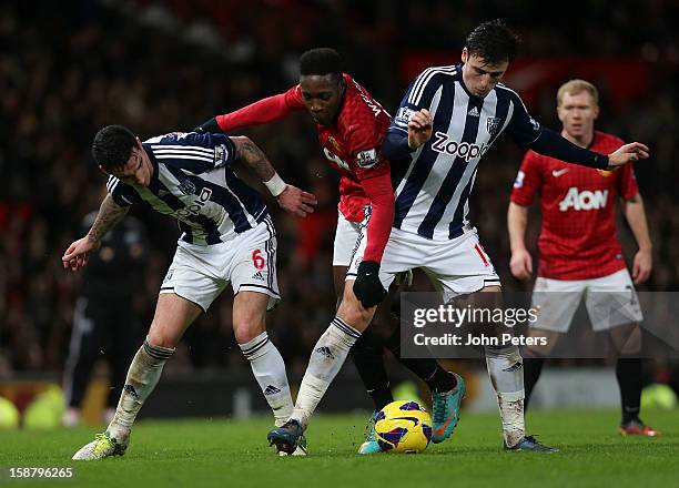 Danny Welbeck of Manchester United in action with Liam Ridgewell and George Thorne of West Bromwich Albion during the Barclays Premier League match...