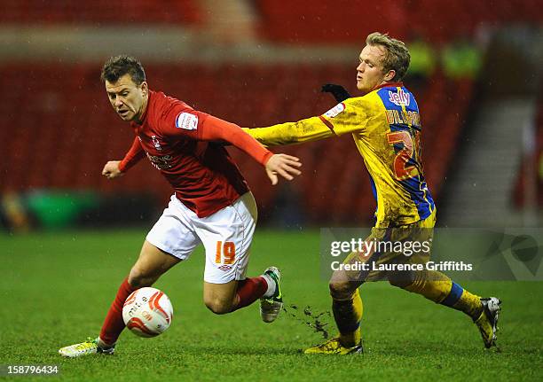Simon Cox of Nottingham Forest battles with Jonathan Williams of Crystal Palace during the npower Championship match between Nottingham Forest and...