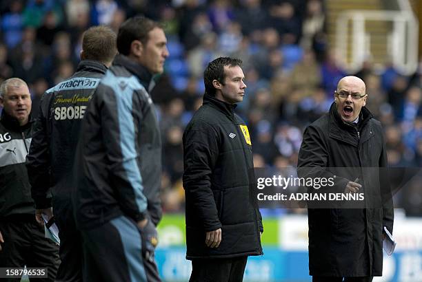 Reading's English manager Brian McDermott gestures toward the West Ham bench during the English Premier League football match between Reading and...