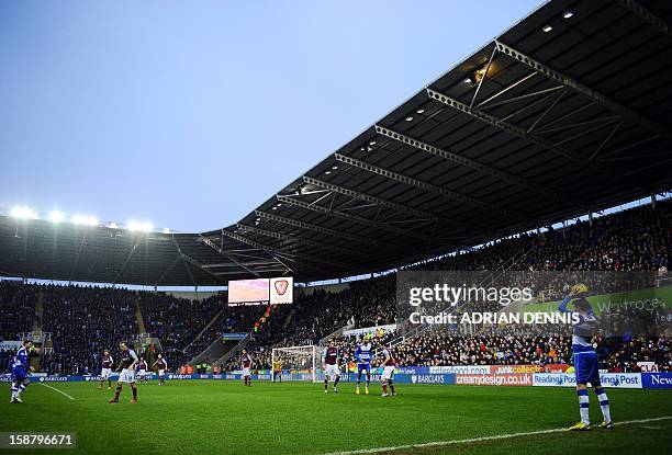 Reading's Russian striker Pavel Pogrebnyak prepares to take a throw against West Ham United during the English Premier League football match between...