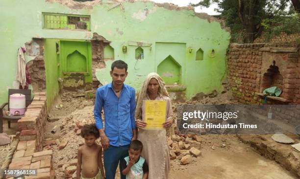 Akbari Begum , resident of Nagina, whose house was demolished by District administration against the illegal construction in Nuh after the communal...