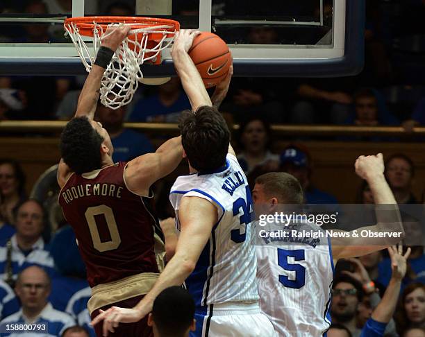 Duke forward Ryan Kelly blocks a shot by Santa Clara guard Evan Roquemore in the second half at Cameron Indoor Stadium in Durham, North Carolina,...