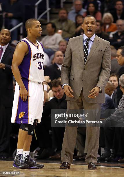 Head coach Alvin Gentry of the Phoenix Suns reacts alongside Sebastian Telfair during the NBA game against the New York Knicks at US Airways Center...