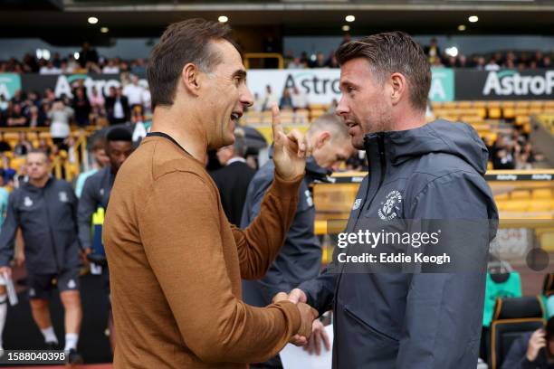 Julen Lopetegui, Manager of Wolverhampton Wanderers, and Rob Edwards, Manager of Luton Town, interact prior to the pre-season friendly match between...