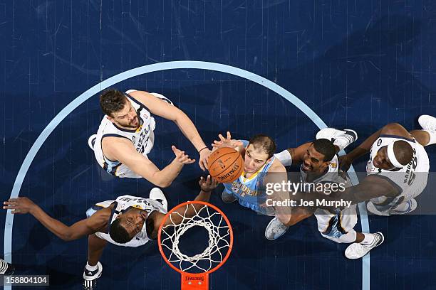 Kosta Koufos the Denver Nuggets rebound against Tony Allen, Marc Gasol, Mike Conley and Zach Randolph of the Memphis Grizzlies on December 29, 2012...