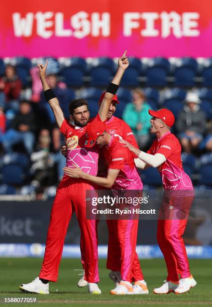 Shaheen Afridi of Welsh Fire celebrates with teammates after Laurie Evans of Manchester Originals is dismissed for Leg Before Wicket (LBW during The...