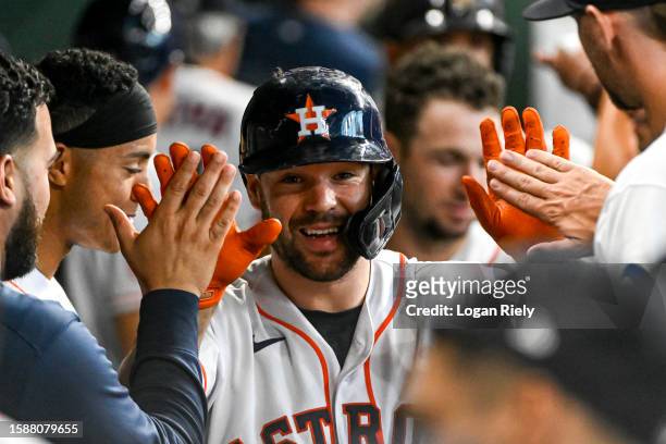 Chas McCormick of the Houston Astros celebrates in the dugout after hitting a two-run home run in the second inning against the Cleveland Guardians...