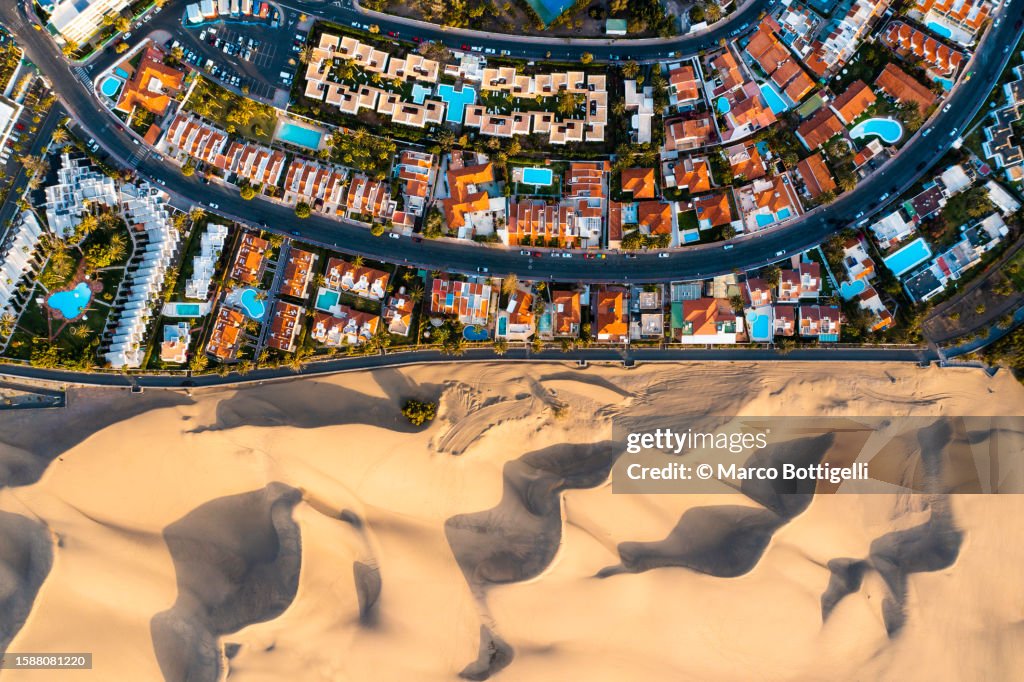 Overhead view of cityscape and sand dunes in Maspalomas, Grand Canary, Spain