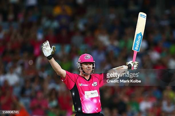 Brett Lee of the Sixers celebrates hitting the winning runs during the Big Bash League match between Sydney Thunder and the Sydney Sixers at ANZ...
