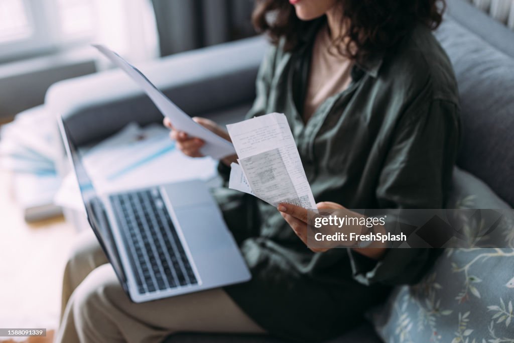 A From Above View Of An Unrecognizable Beautiful Businesswoman Working From Home On Her Computer