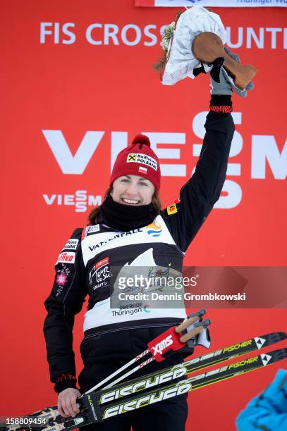 Justyna Kowalczyk of Poland celebrates after winning the Women's 9km Classic Pursuit at the FIS Cross Country World Cup event at DKB Ski Arena on...