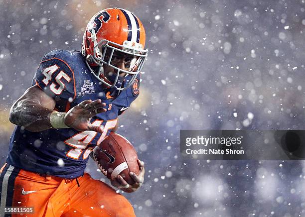 Jerome Smith of the Syracuse Orange runs the ball against the West Virginia Mountaineers during the New Era Pinstripe Bowl at Yankee Stadium on...