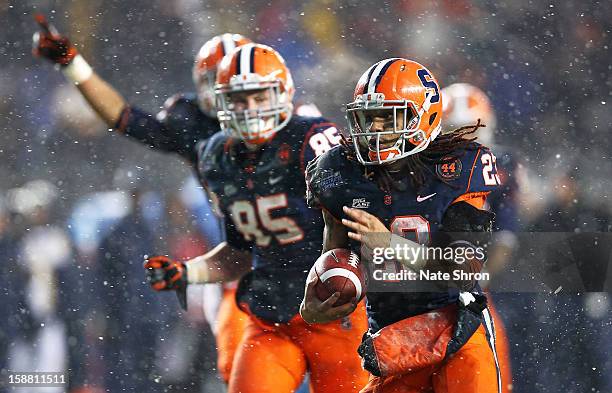 Prince-Tyson Gulley of the Syracuse Orange runs for a touchdown and celebrates with teamate Beckett Wales against the West Virginia Mountaineers...