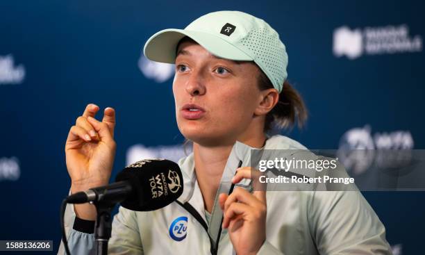 Iga Swiatek of Poland talks to the media after defeating Karolina Pliskova of the Czech Republic in the second round on Day 3 of the National Bank...