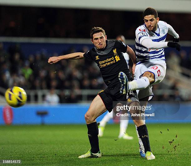 Joe Allen of Liverpool competes with Adel Taarabt of Queens Park Rangers during the Barclays Premier League match between Queens Park Rangers and...