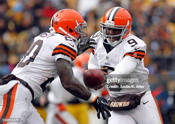 Thad Lewis of the Cleveland Browns hands off to Montario Hardesty against the Pittsburgh Steelers during the game on December 30, 2012 at Heinz Field...