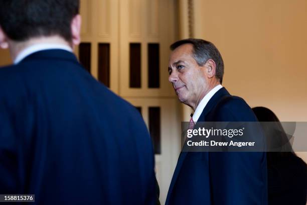 Speaker of the House John Boehner walks outside the House Chamber on Capitol Hill on December 30, 2012 in Washington, DC. The House and Senate are...