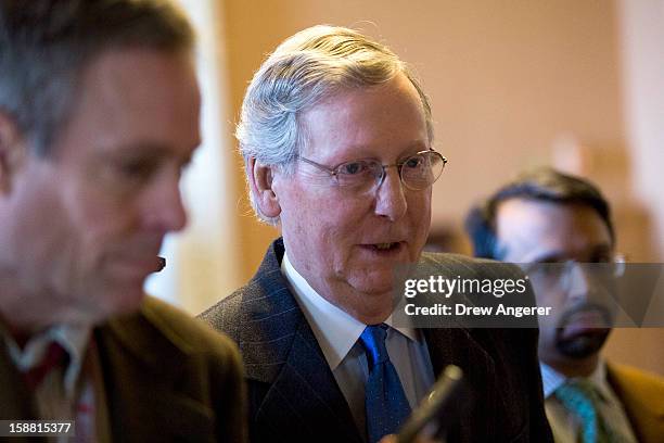 Senate Minority Leader Mitch McConnell walks toward his office on Capitol Hill December 30, 2012 in Washington, DC. The House and Senate are both in...